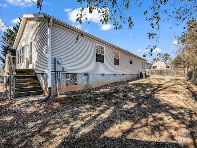 rear view of house with central AC