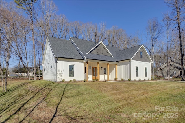 modern inspired farmhouse with a front lawn