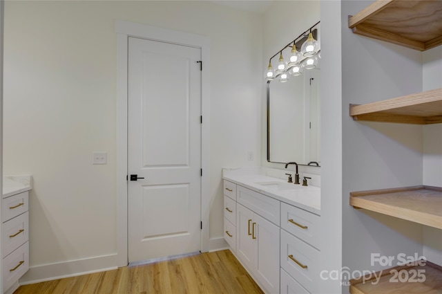 bathroom with wood-type flooring and vanity