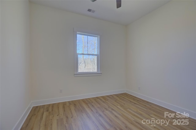 unfurnished room with ceiling fan and light wood-type flooring