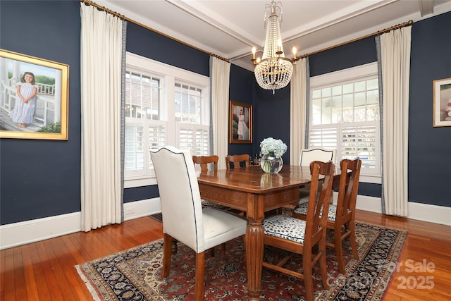 dining room featuring hardwood / wood-style flooring and a chandelier