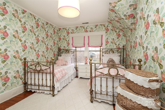 bedroom featuring crown molding