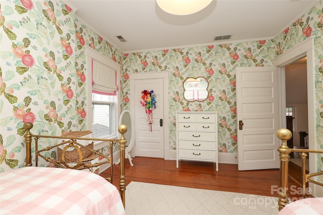 bedroom with wood-type flooring