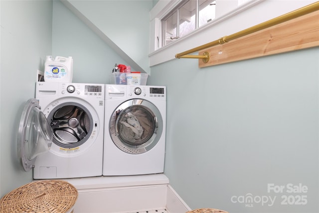 laundry room with washing machine and dryer