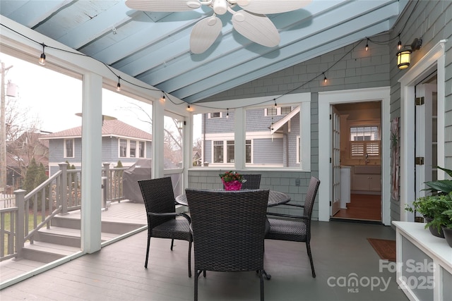 sunroom / solarium featuring vaulted ceiling and ceiling fan