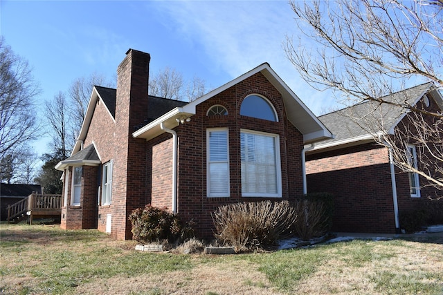 view of property exterior featuring a lawn