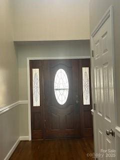 entryway with dark hardwood / wood-style flooring