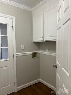 laundry area with washer hookup, crown molding, dark hardwood / wood-style flooring, and cabinets