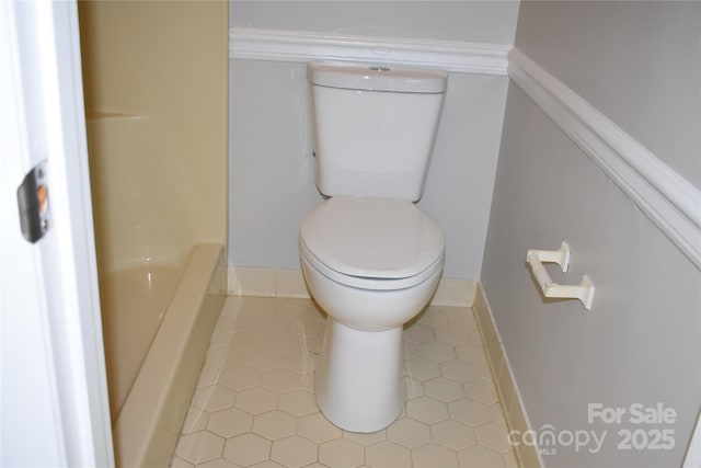 bathroom with tile patterned floors and toilet