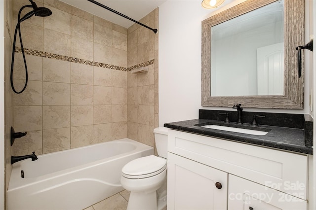 full bath with tile patterned floors, bathing tub / shower combination, toilet, and vanity