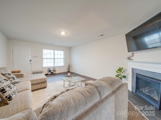 living room with dark hardwood / wood-style floors