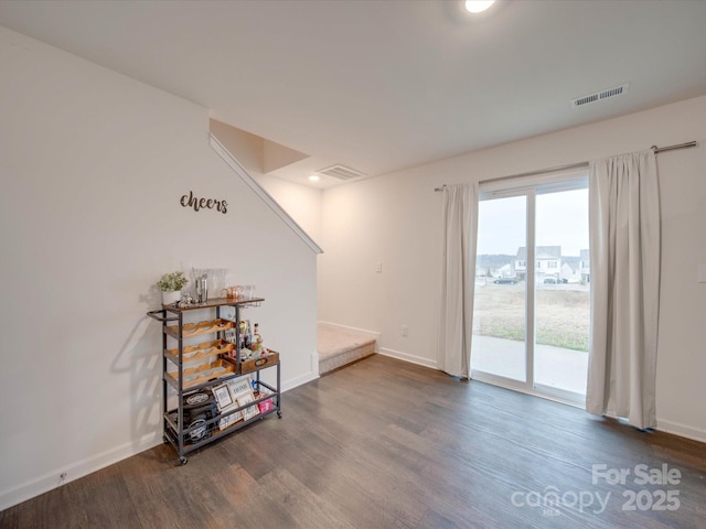 spare room with wood-type flooring