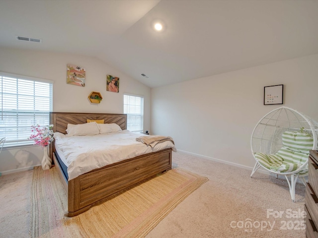 carpeted bedroom featuring lofted ceiling