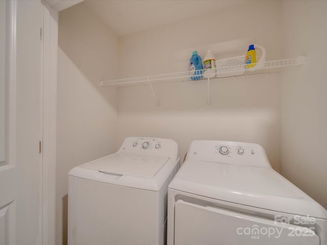 washroom with washing machine and dryer