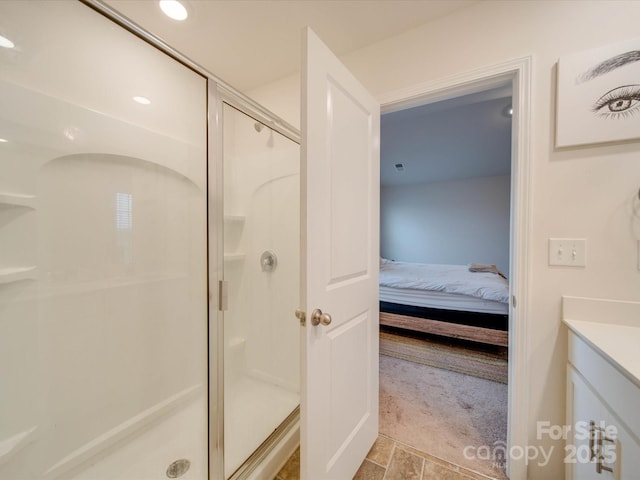 bathroom with vanity and a shower with shower door