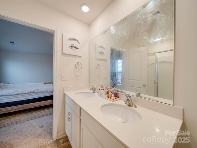 bathroom with vanity and an enclosed shower