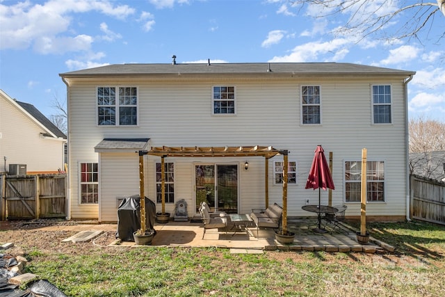 back of house with central AC unit, a yard, a pergola, and a patio area