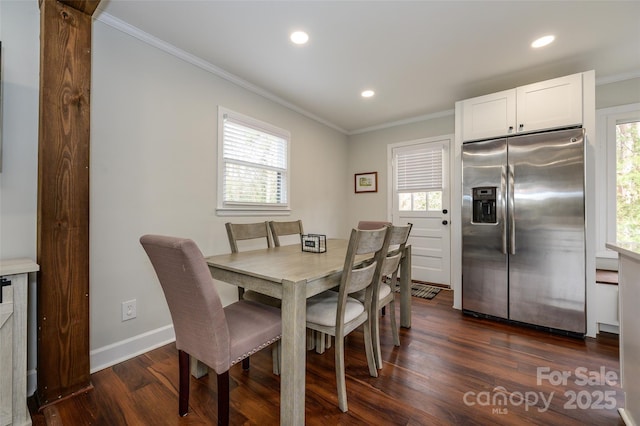 dining room featuring crown molding and dark hardwood / wood-style flooring