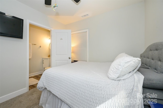 bedroom with connected bathroom and ceiling fan