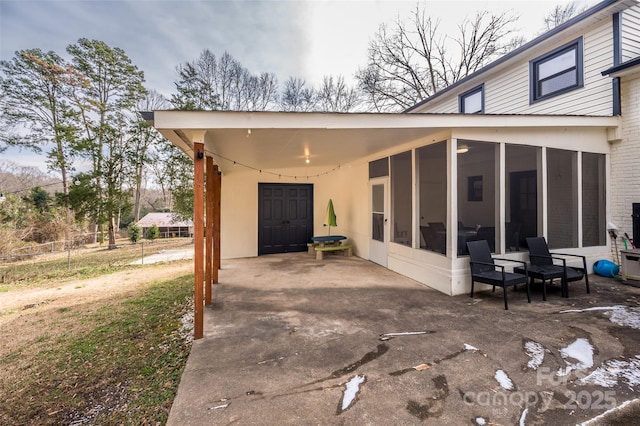 exterior space featuring a sunroom