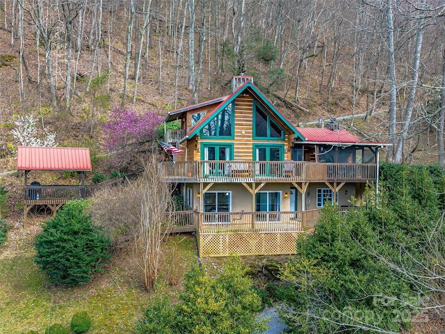 rear view of property with a deck