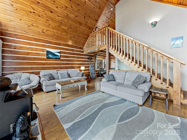 living room with hardwood / wood-style floors, wood ceiling, and high vaulted ceiling