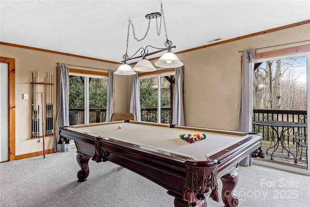 rec room with crown molding, carpet floors, and a wealth of natural light