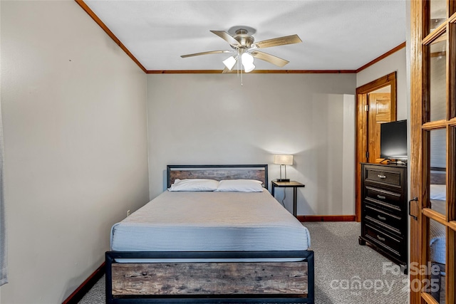 carpeted bedroom featuring ornamental molding and ceiling fan