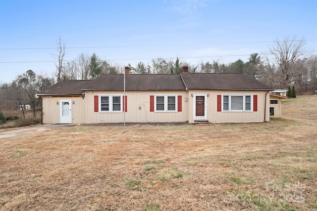 ranch-style house with a front lawn