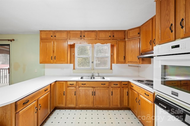 kitchen featuring sink and white appliances