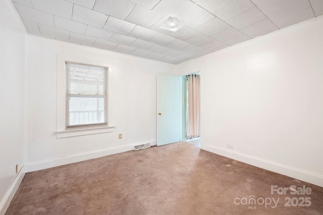 empty room featuring carpet flooring