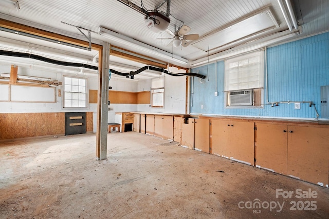 interior space featuring cooling unit and ceiling fan