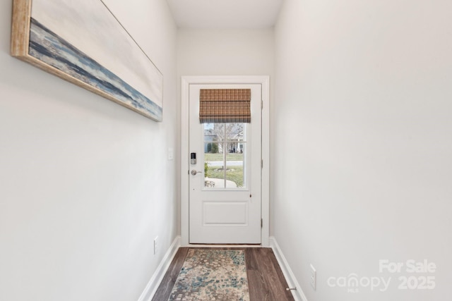 doorway to outside with dark hardwood / wood-style floors