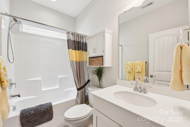 full bathroom featuring vanity, shower / tub combo, and toilet