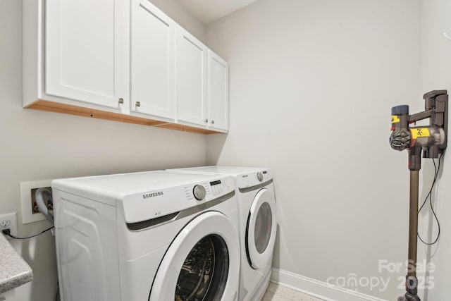 laundry area featuring cabinets and independent washer and dryer