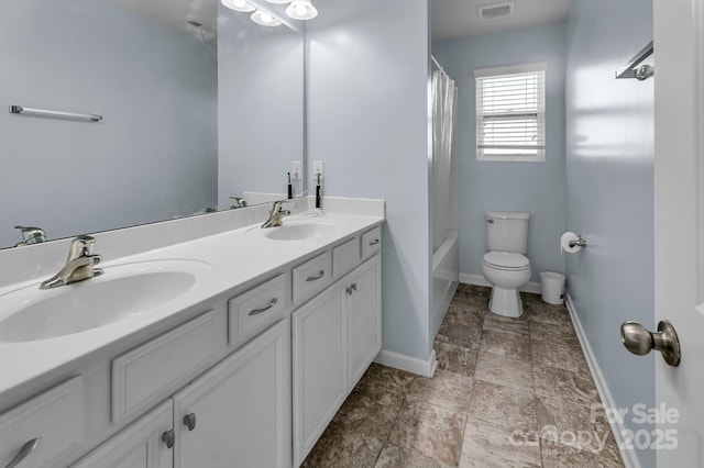 full bathroom with vanity, toilet, and shower / bath combo with shower curtain