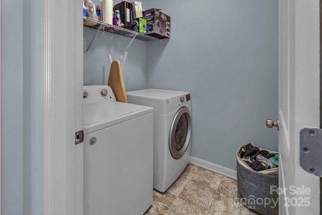 clothes washing area with separate washer and dryer