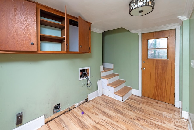 laundry area with crown molding, cabinets, hookup for an electric dryer, and hookup for a washing machine