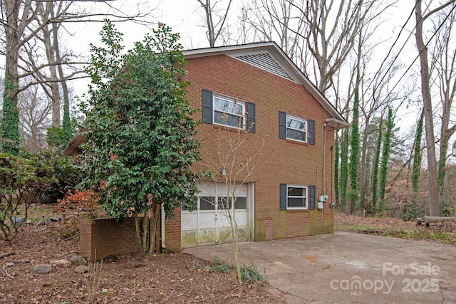 view of property exterior with a garage