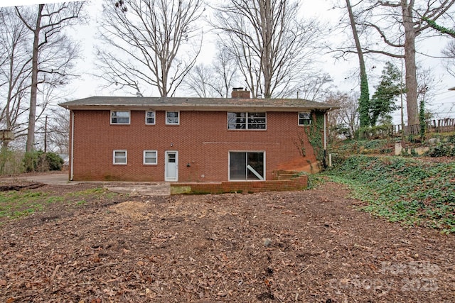 back of property with a patio