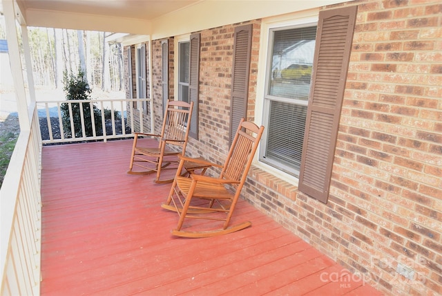 wooden terrace featuring a porch