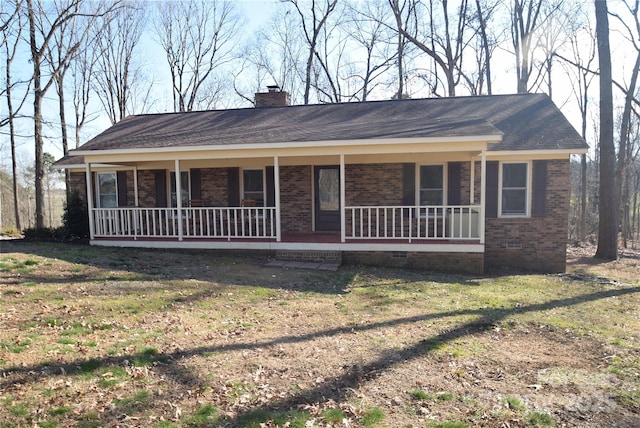 ranch-style house featuring crawl space, covered porch, and brick siding