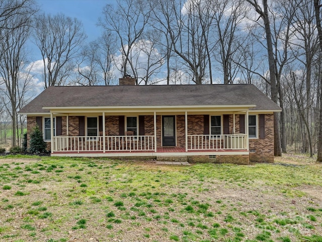 ranch-style house with brick siding, a front lawn, a porch, a chimney, and crawl space