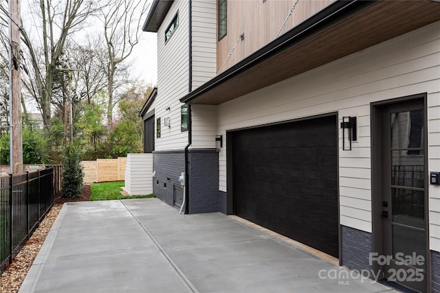 view of side of home with a garage