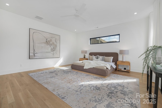 bedroom featuring hardwood / wood-style floors and ceiling fan