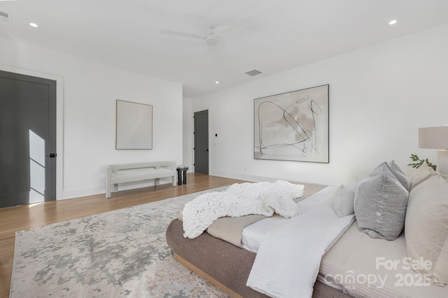 bedroom with wood-type flooring and ceiling fan