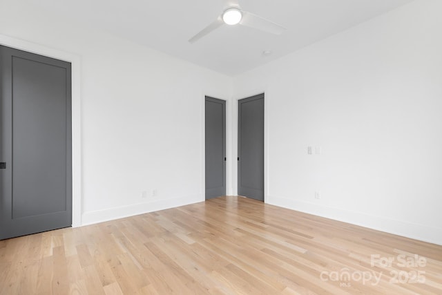 empty room featuring ceiling fan and light wood-type flooring