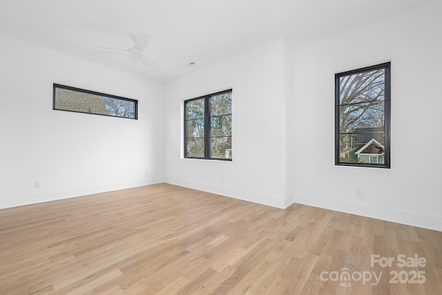 spare room featuring ceiling fan and light hardwood / wood-style floors