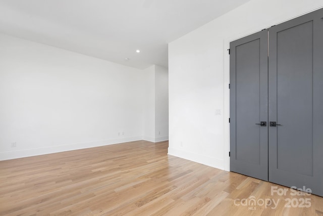 unfurnished room featuring light wood-type flooring