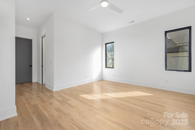 unfurnished room with light hardwood / wood-style flooring and ceiling fan